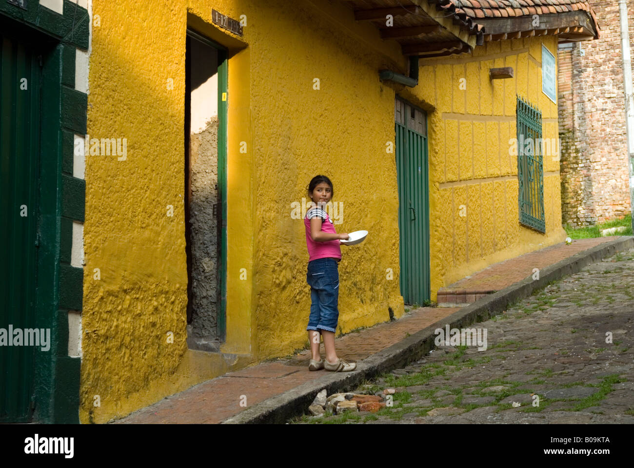 Child in the street in La Candelaria, Bogota, Colombia Stock Photo