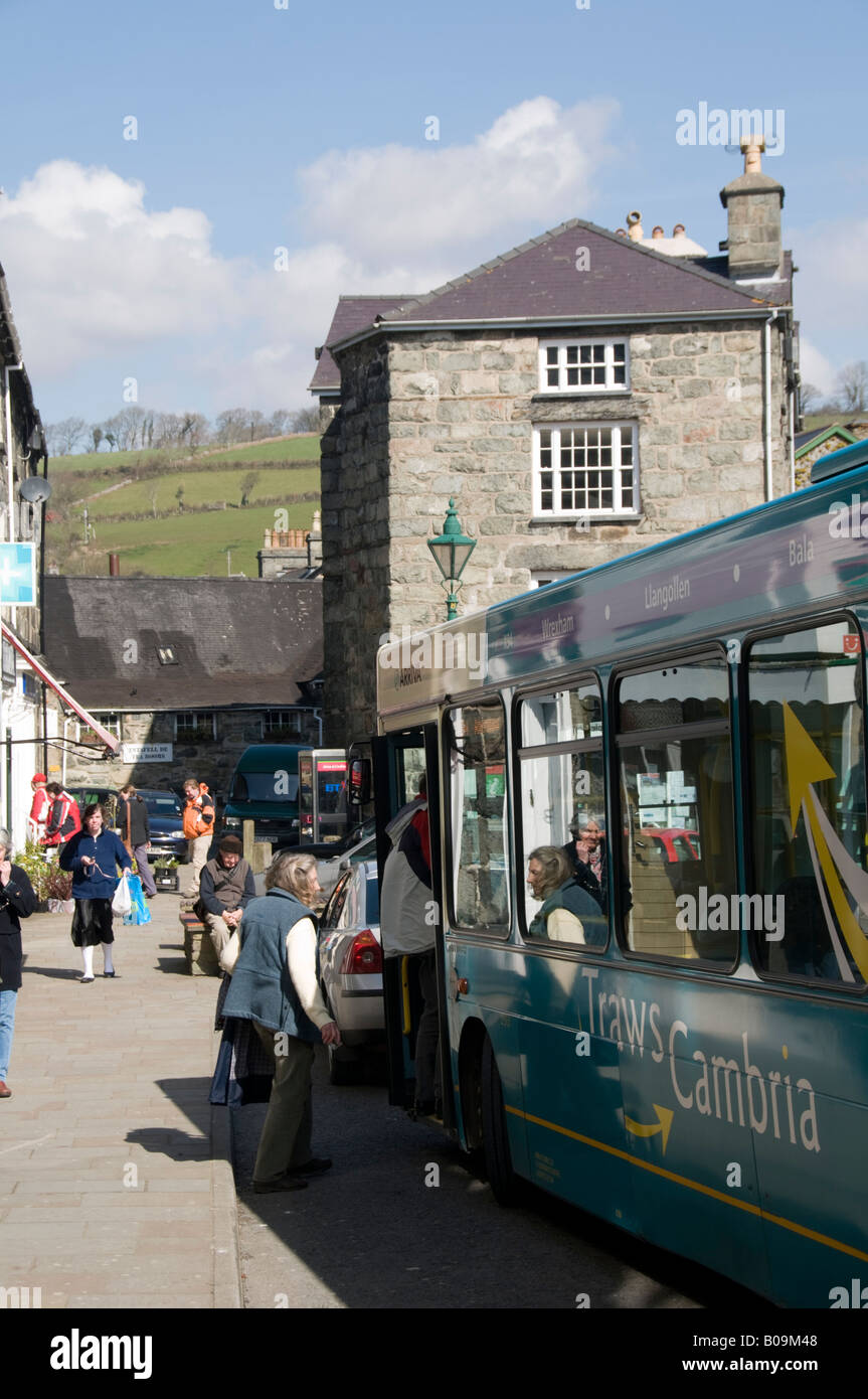 Passengers boarding an Arriva Wales Traws Cambria bus in the main