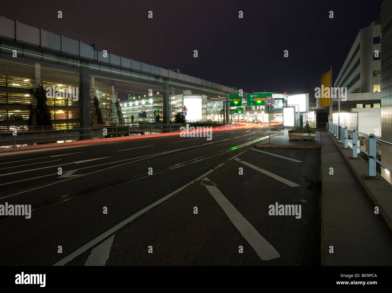 road to terminal at airport Dusseldorf at night, long exposure Stock Photo