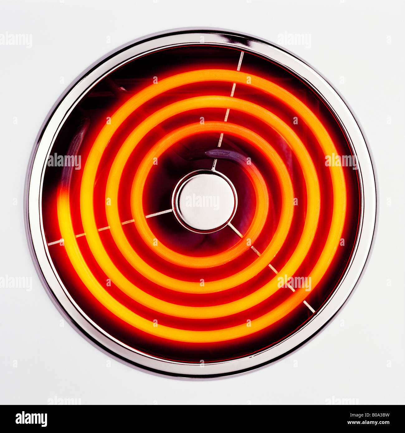 a straight on picture of an electric cooker hob switched on at the full setting Stock Photo