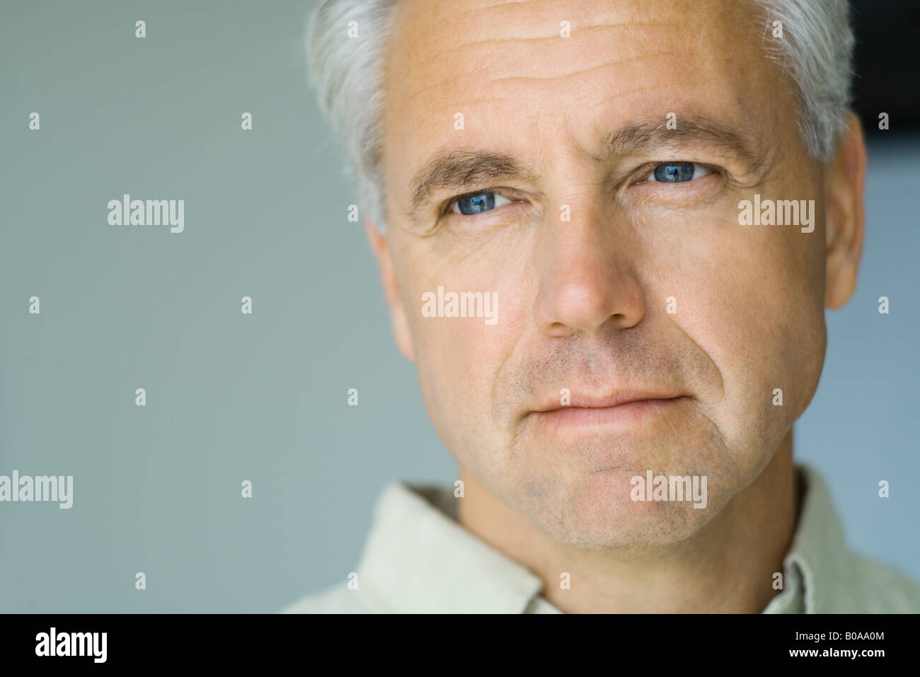 Mature man, looking out of frame, close-up, portrait Stock Photo