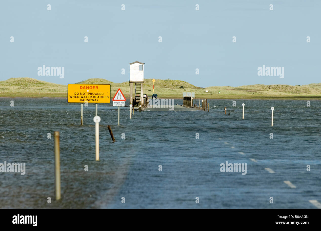 The tidal Beal Causeway to Lindisfarne, Holy Island, the road covered
