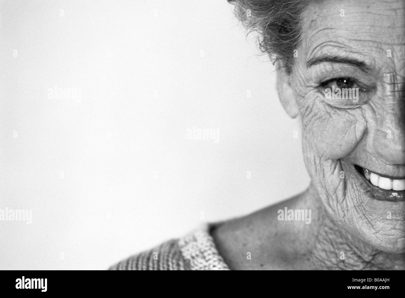 Senior woman smiling at camera, portrait, cropped Stock Photo