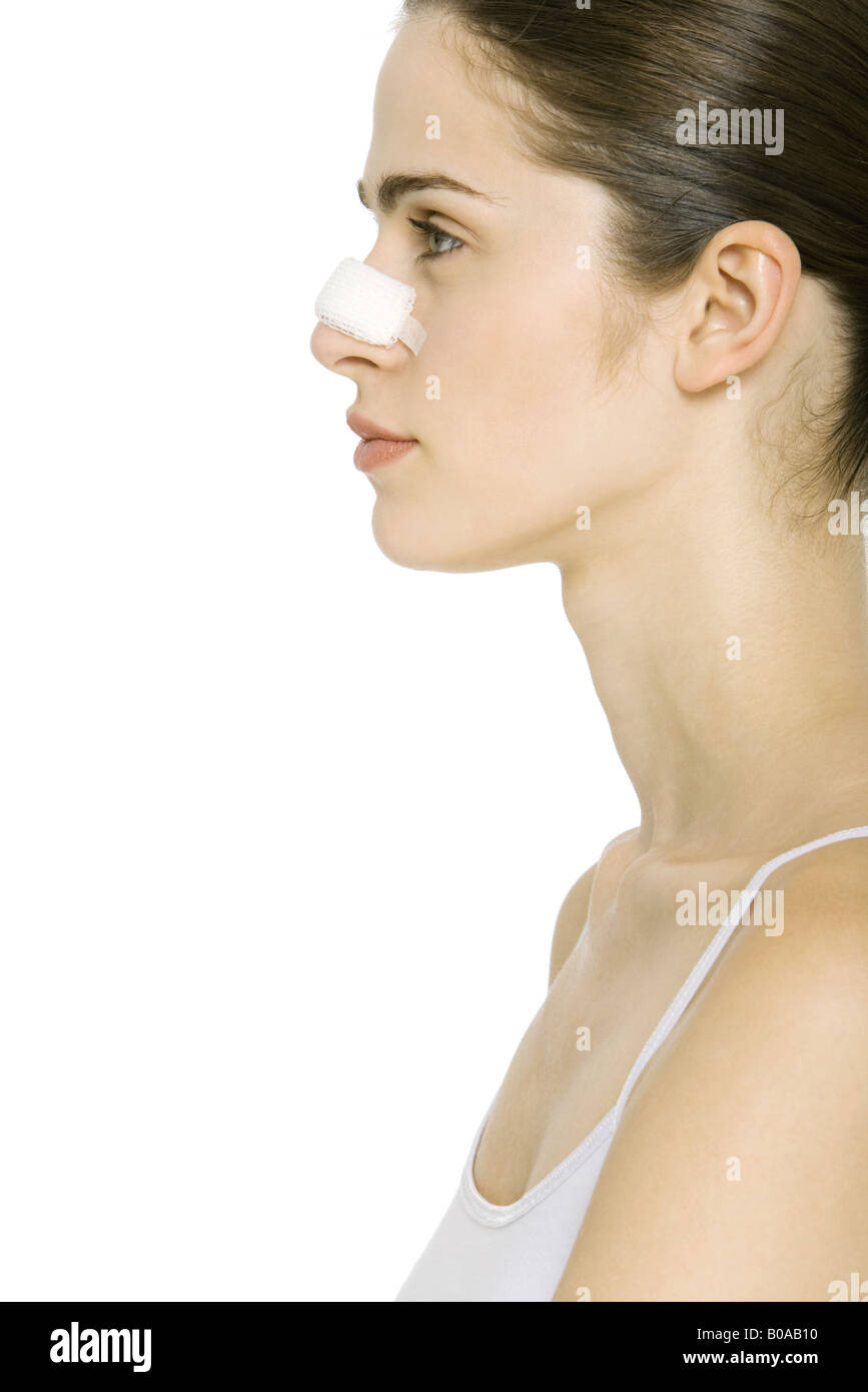 Young woman with bandage on nose, profile Stock Photo