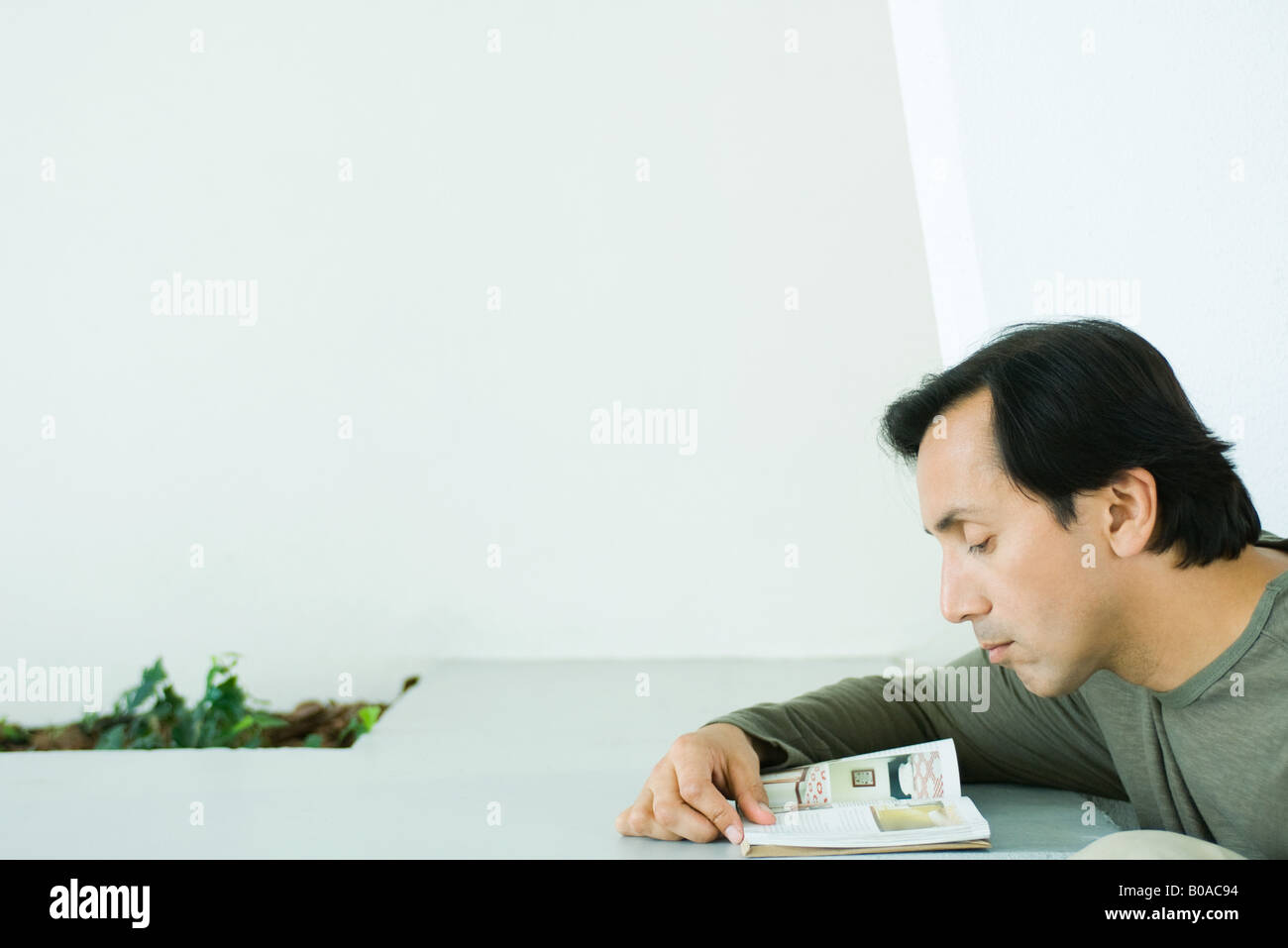 Man reading book, cropped view Stock Photo