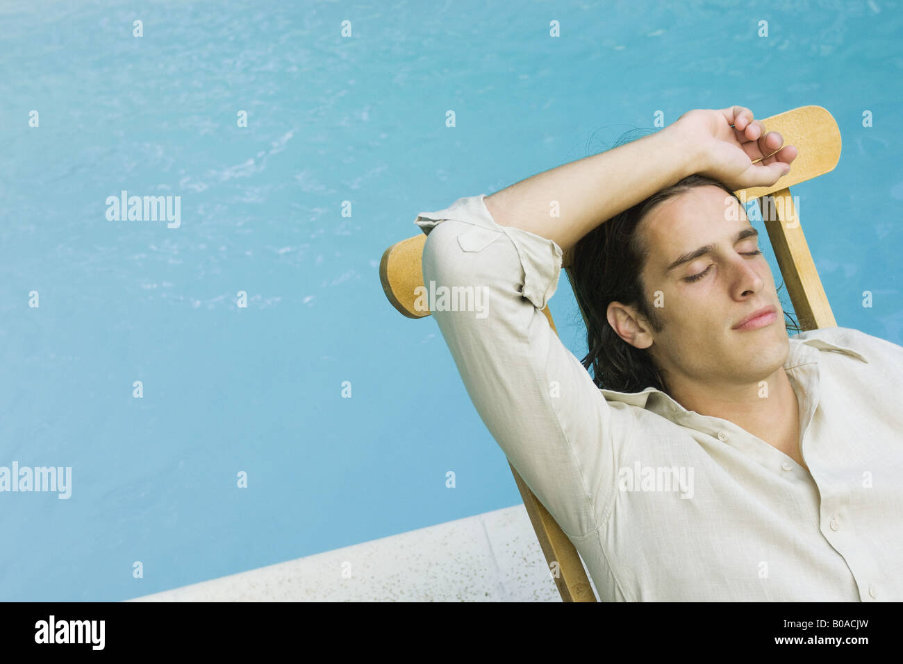 Man Sitting In Lounge Chair Beside Swimming Pool Eyes