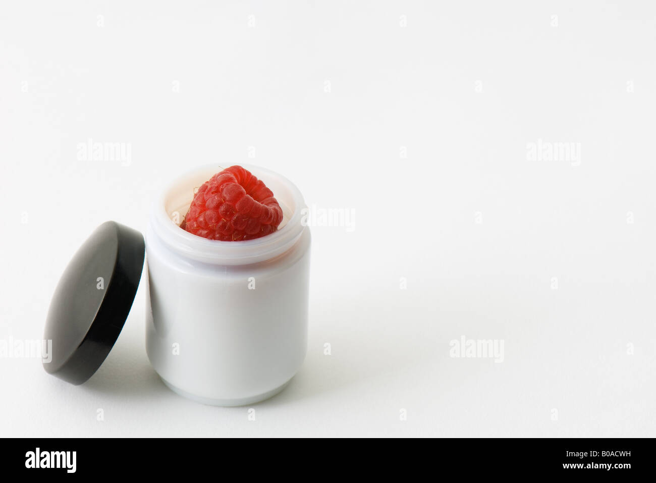 Raspberry in small jar Stock Photo