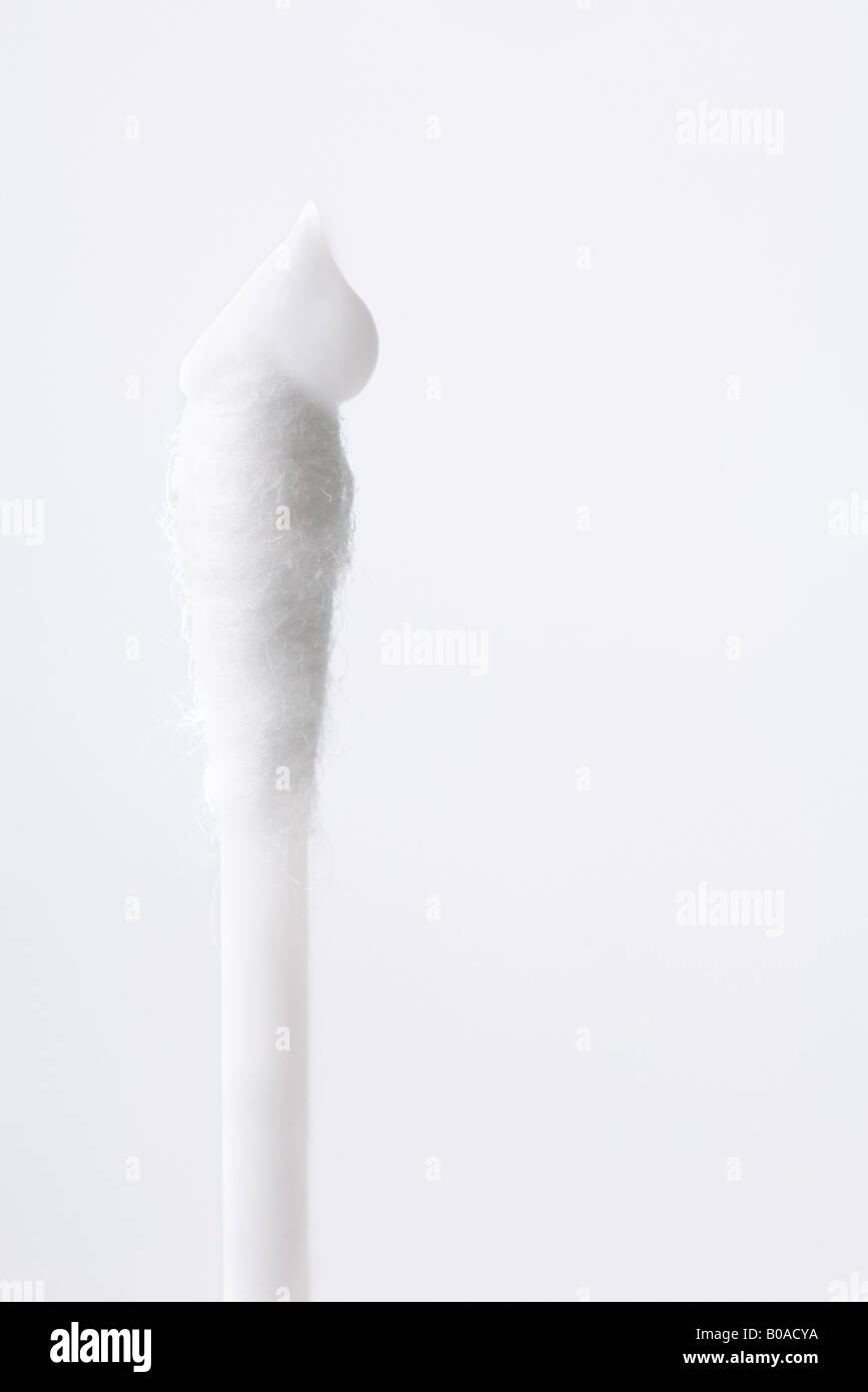 Cotton swab with dollop of cream, close-up Stock Photo