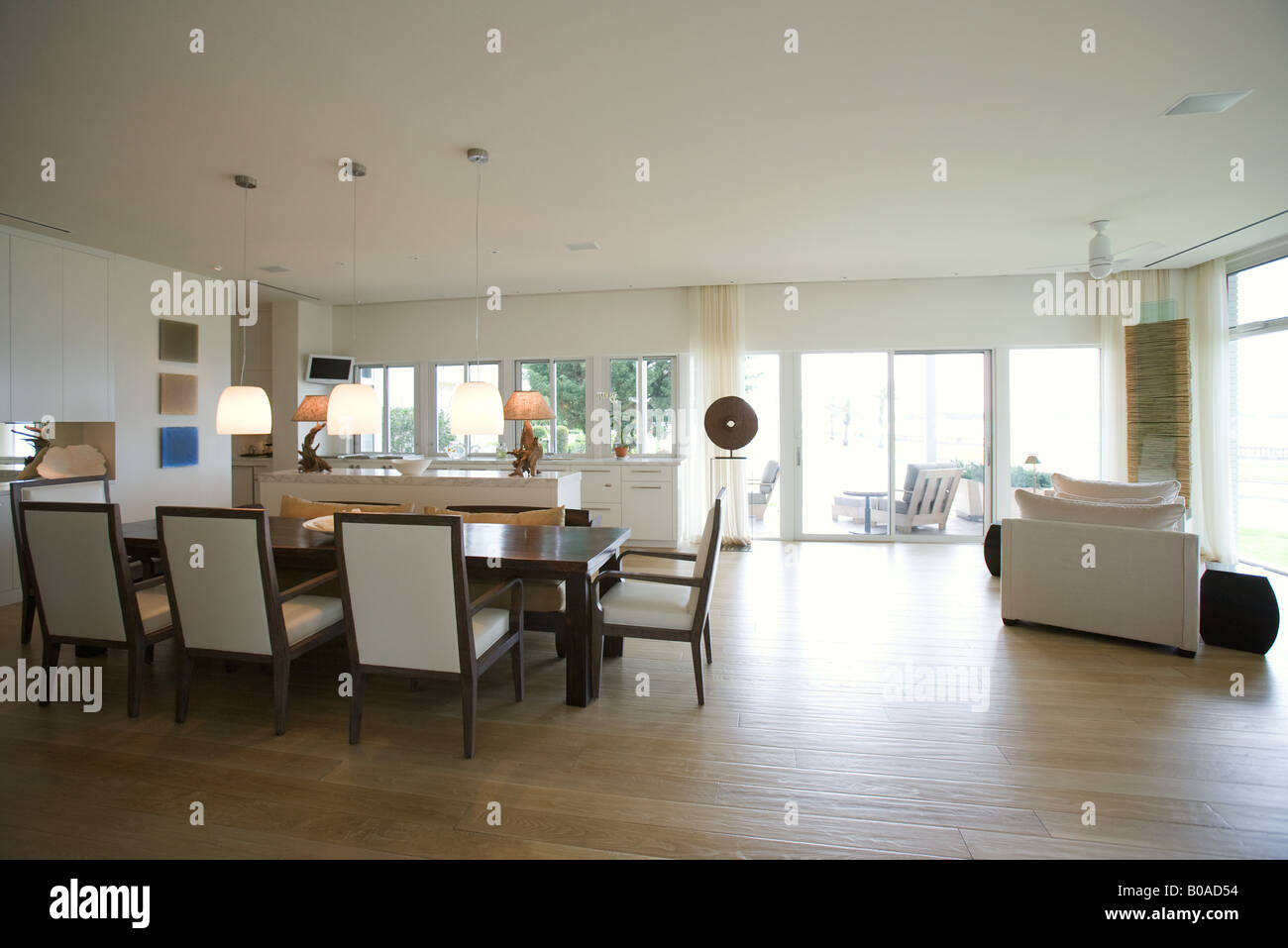 Home interior with open dining room and living room Stock Photo