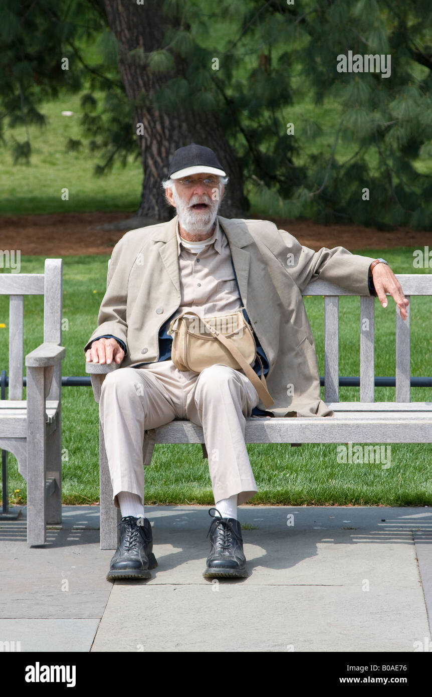 Old man resting on a bench in NY Botanical Garden Stock Photo - Alamy