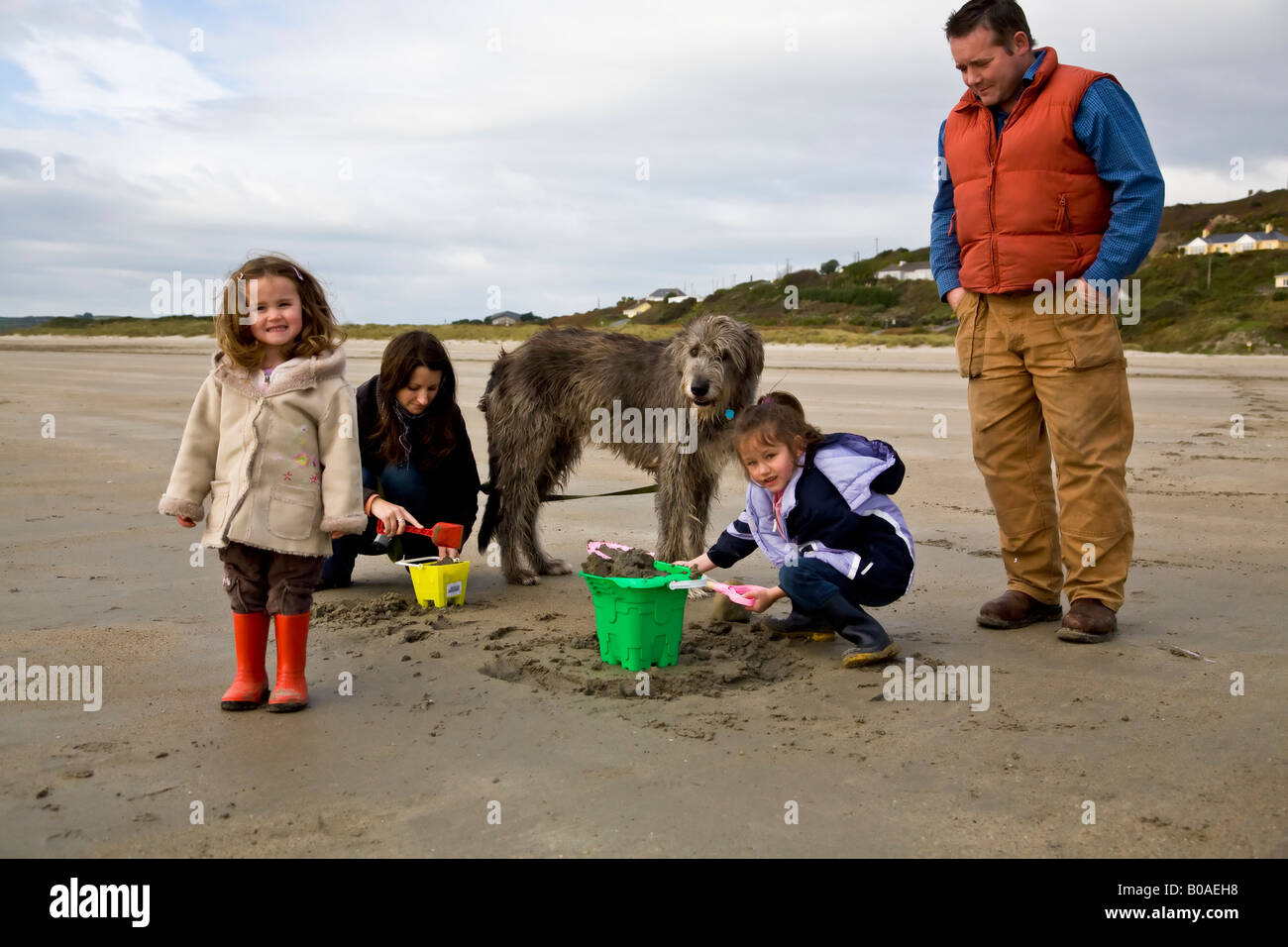 Family On Beach Inchidony West Cork Ireland Stock Photo