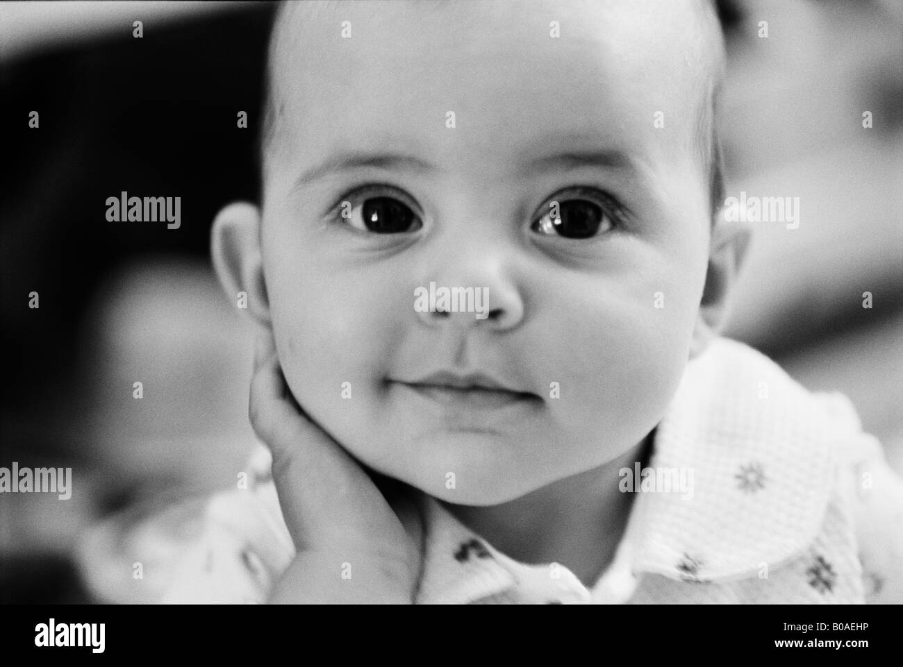 A sweet portrait of a little baby girl smiling Stock Photo