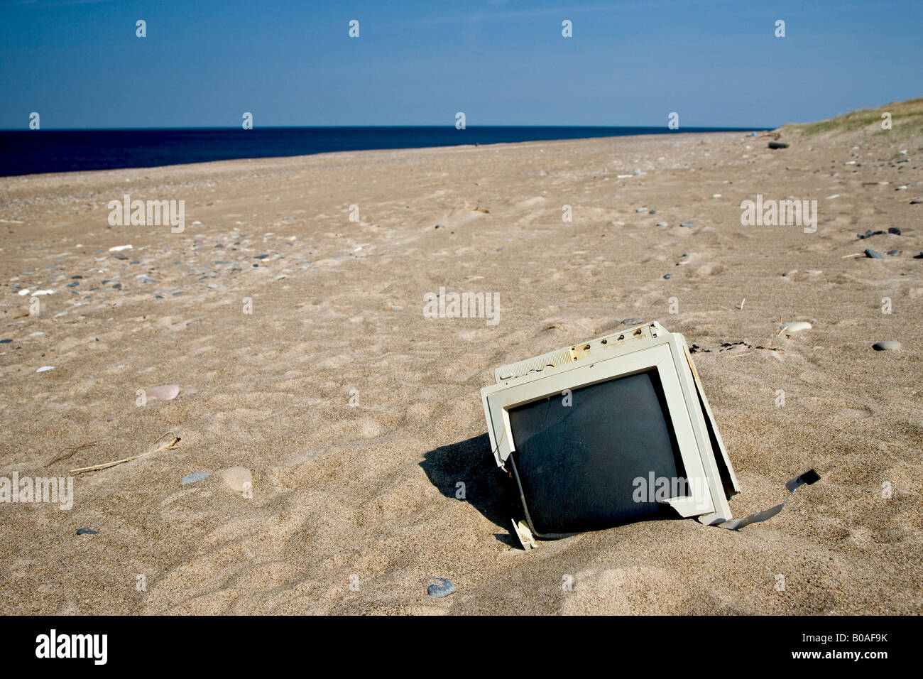 Electronic waste on the beach Stock Photo