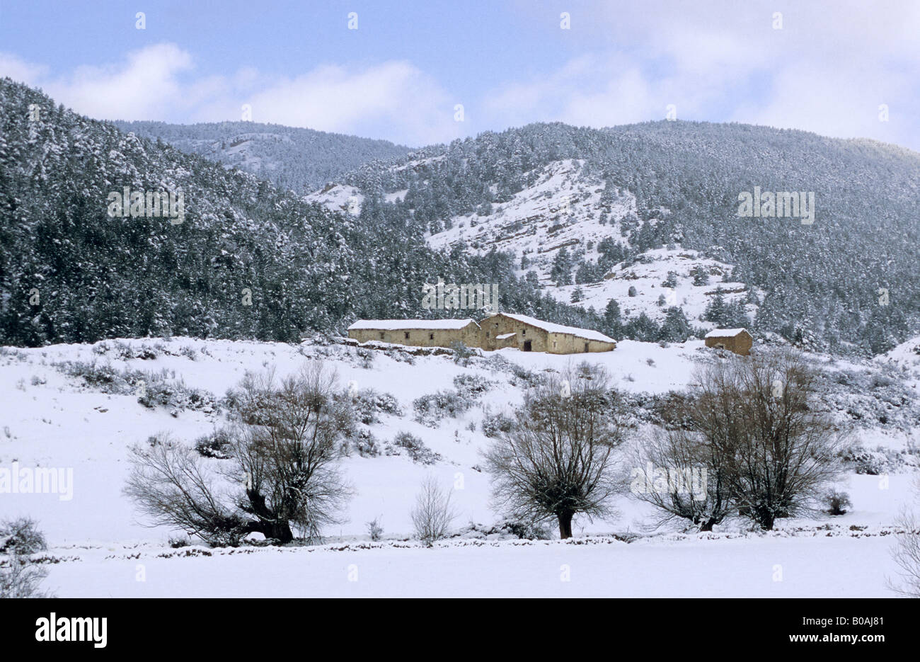 Village houses snowy mountains at Sierra Gudar, Teruel province, Spain Stock Photo
