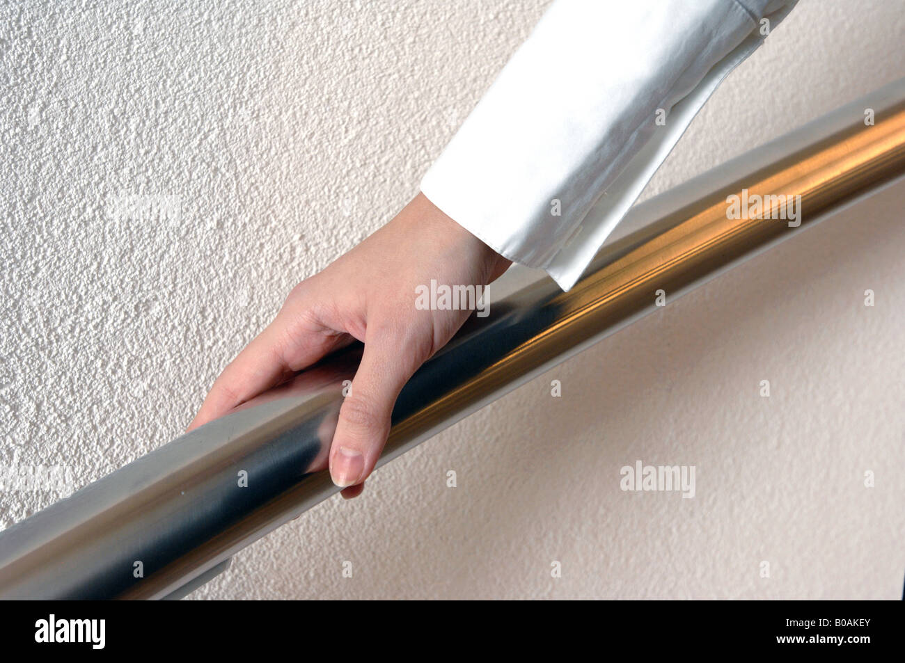 male hand on a hand rail Stock Photo