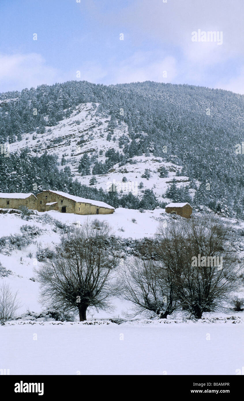 Village houses snowy mountains at Sierra Gudar, Teruel province, Spain Stock Photo