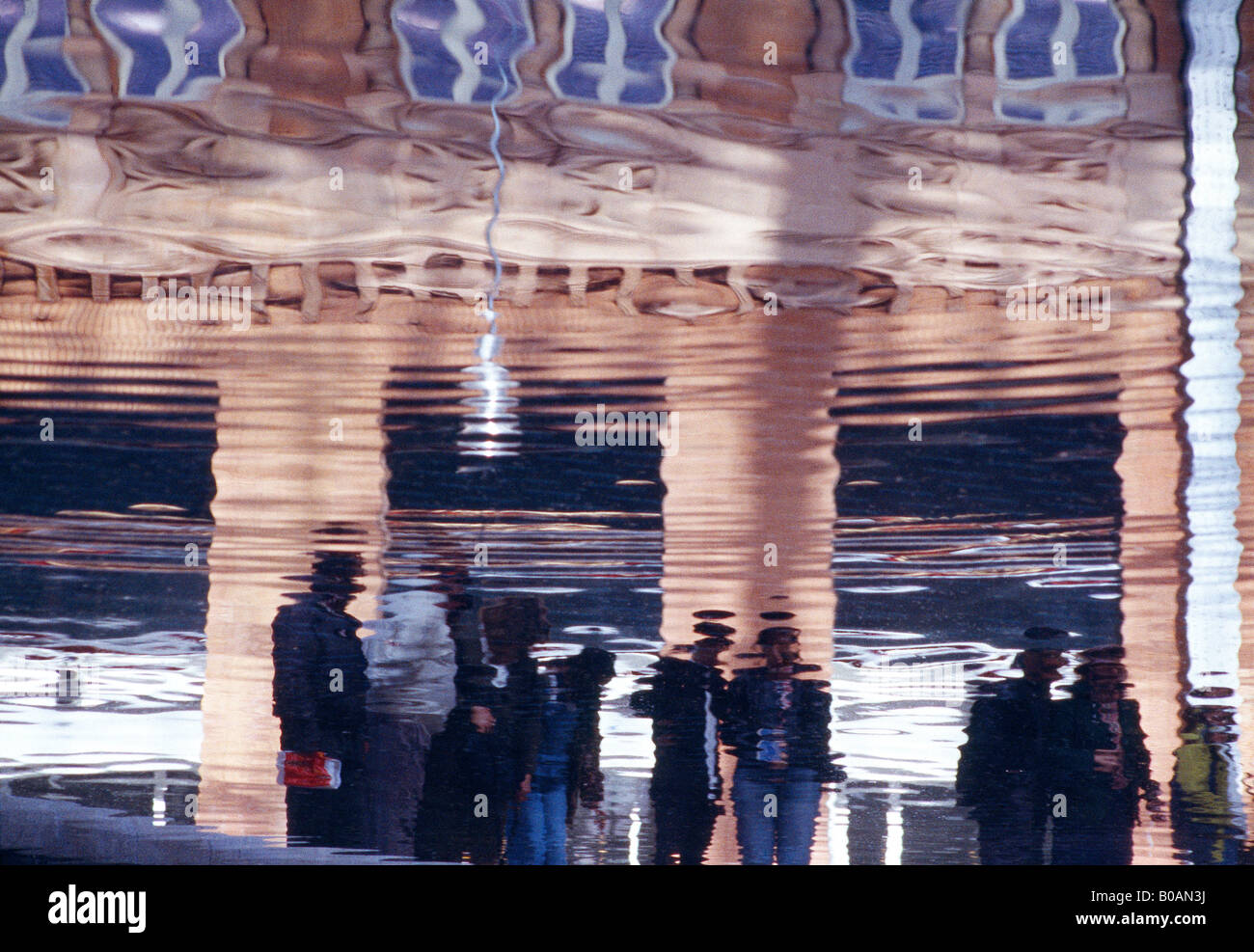 Reflection of people on water. Stock Photo