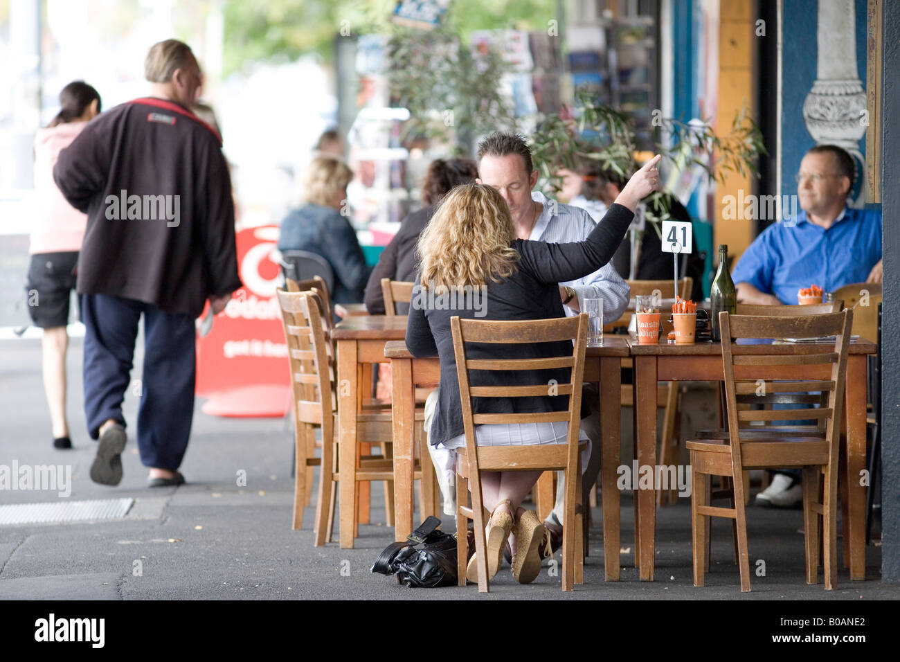 People relaxing at the Hardware Cafe,Titirangi Village Stock Photo Alamy