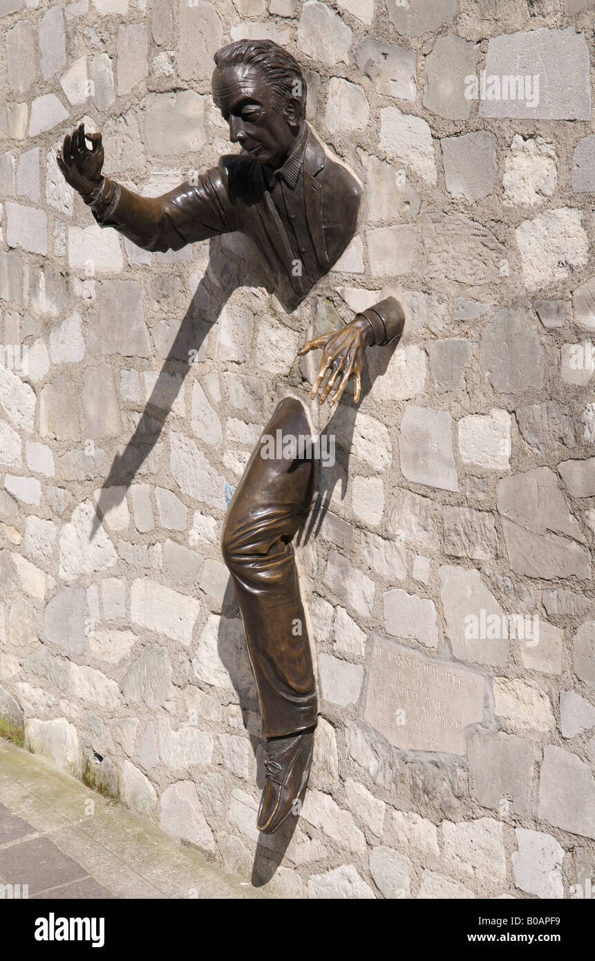 Le passe-muraille the man who could walk through walls sculpture in Montmatre, Paris Stock Photo