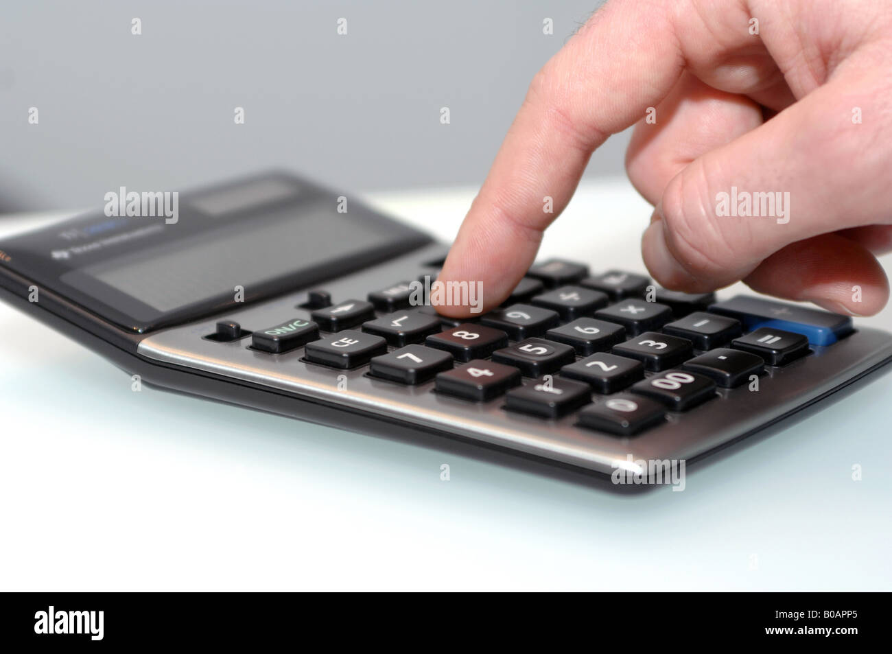 hand operating a calculator Stock Photo