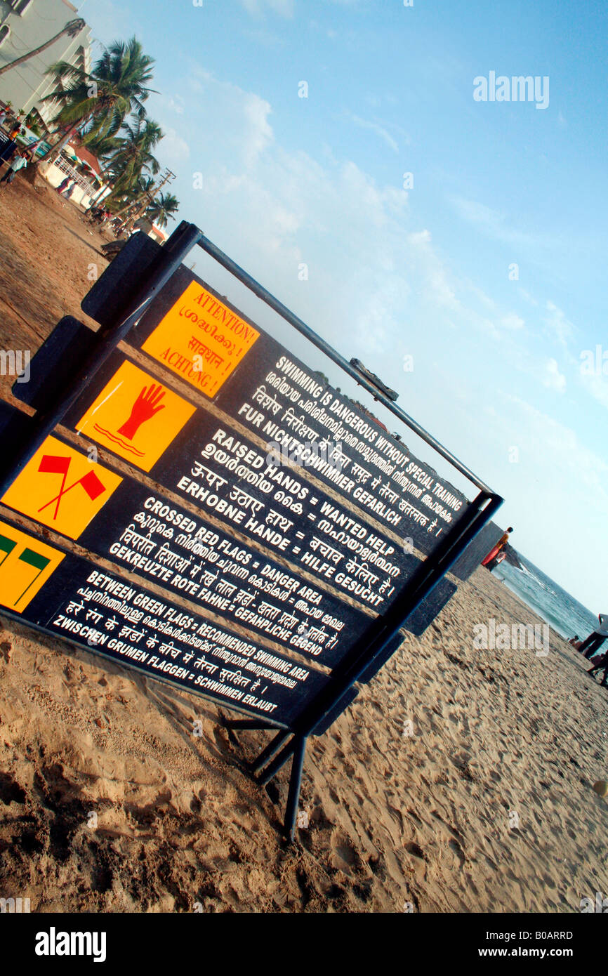 Signboard on a beach in Kovalam displaying easily-understood symbols regarding safety measures and minimizing risk of drowning Stock Photo