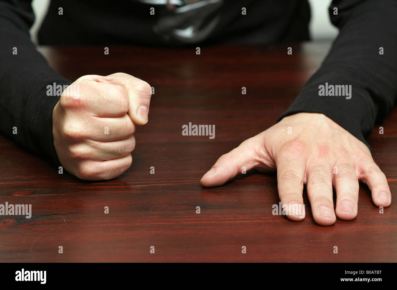 Man banging his fist on the table Stock Photo