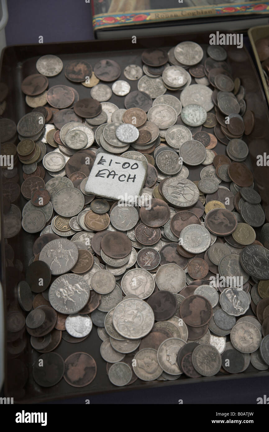 Old silver coins on sale on market stall Stock Photo Alamy