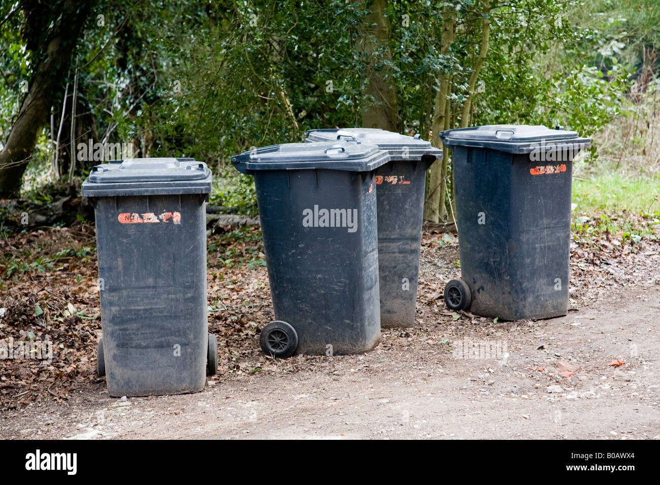 Waste bins awaiting collection in a country lane, Surrey, England Stock