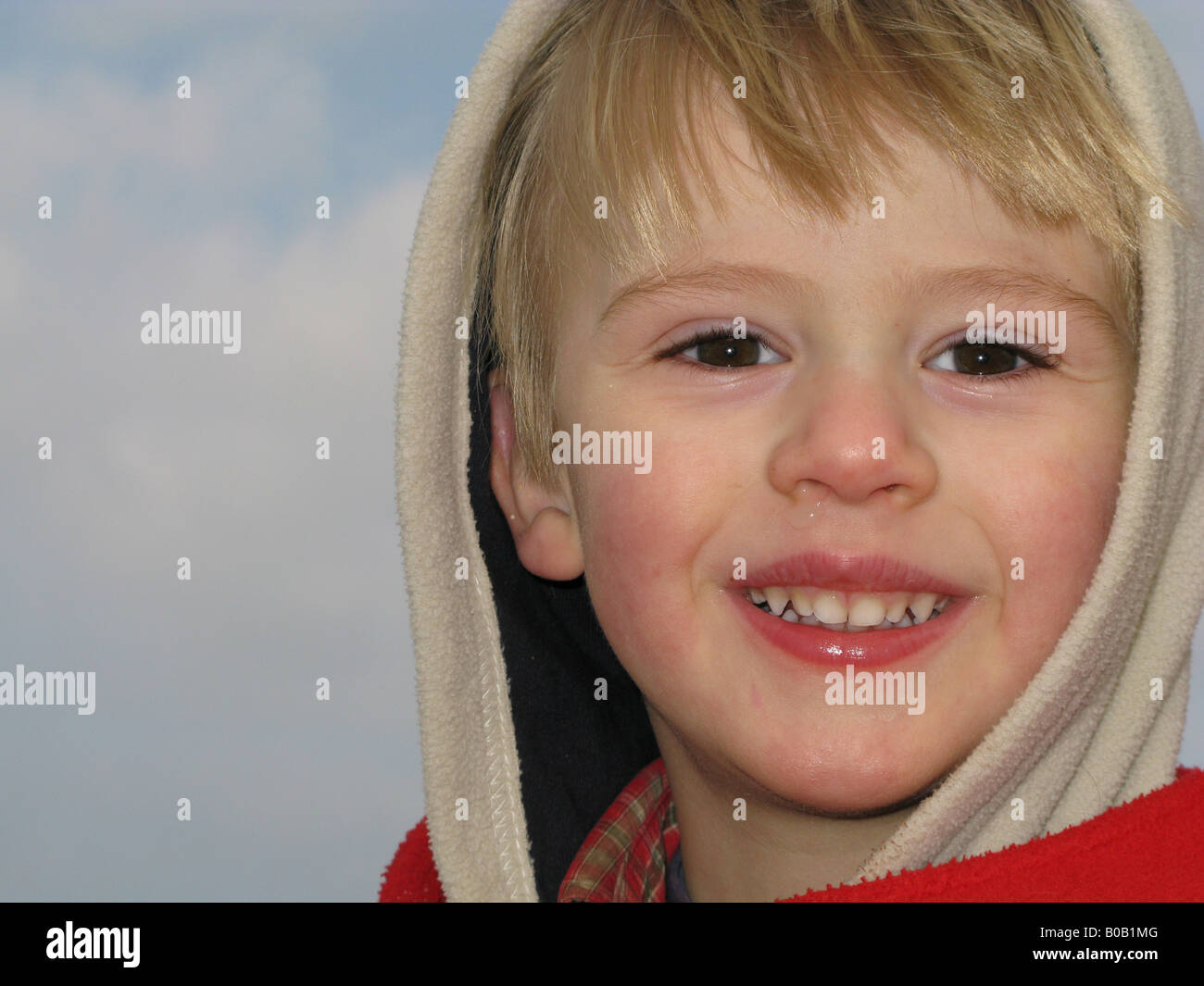 Blond boy smiling at camera Stock Photo - Alamy