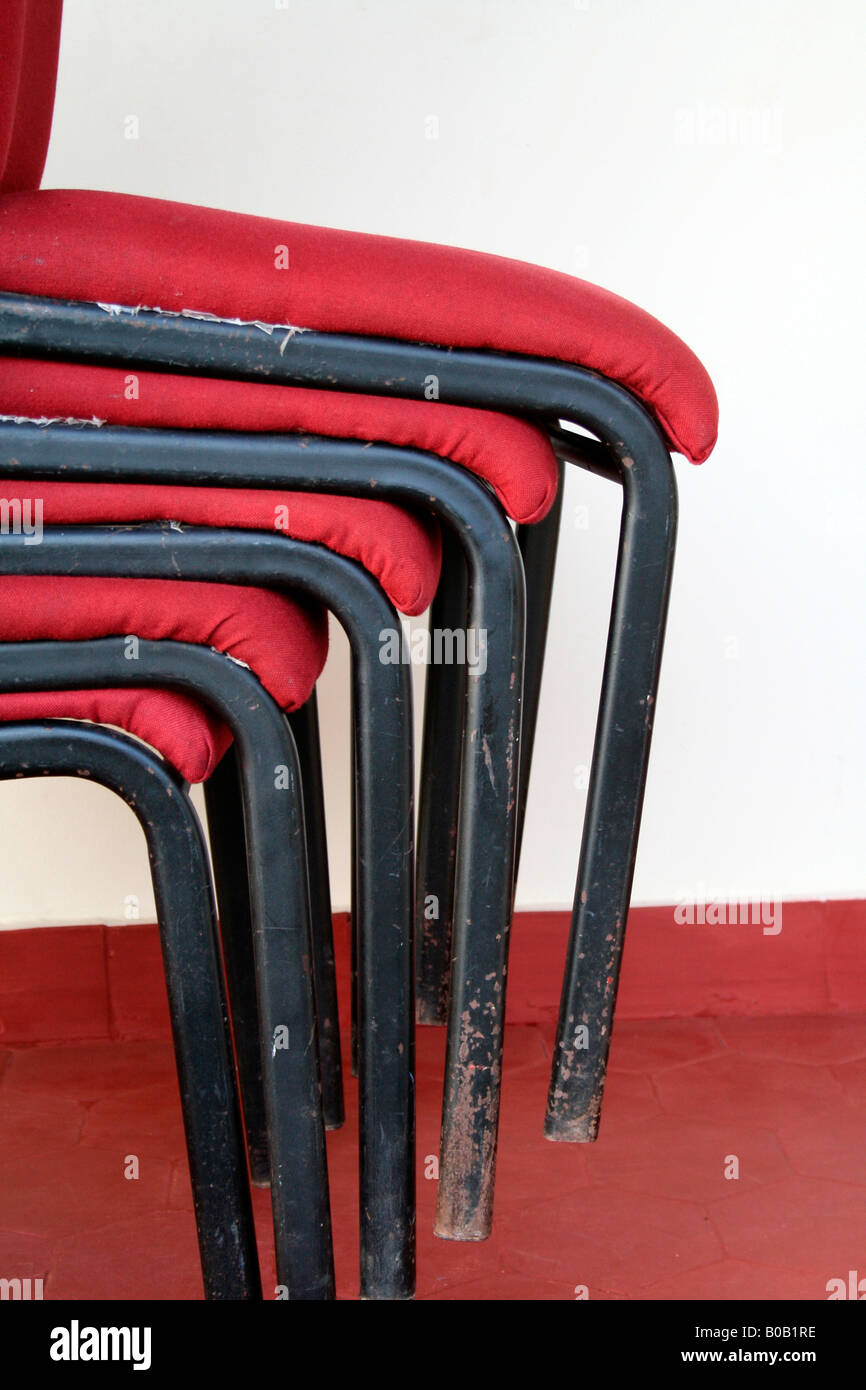 Detail of chairs stacked up in the conference room of a hotel Stock Photo