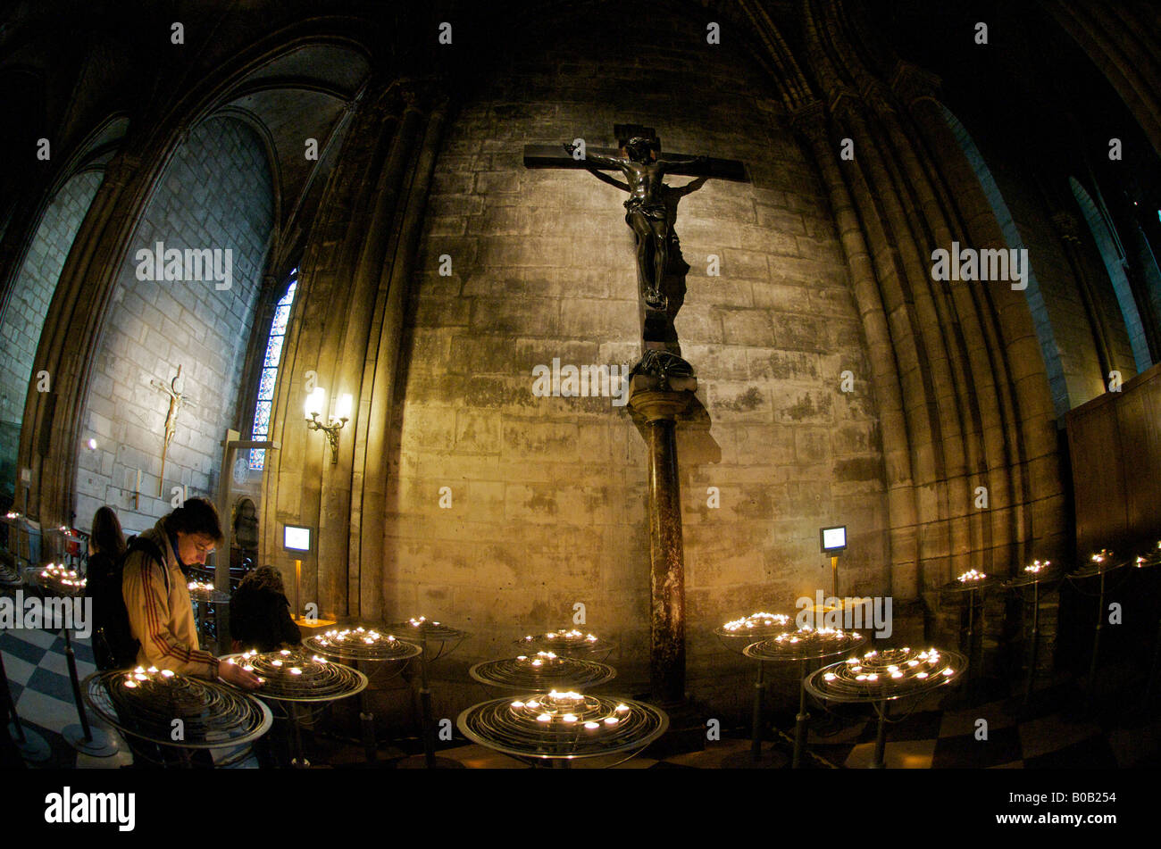 Man lighting a candle in Notre Dame Cathedral Paris Stock Photo Alamy