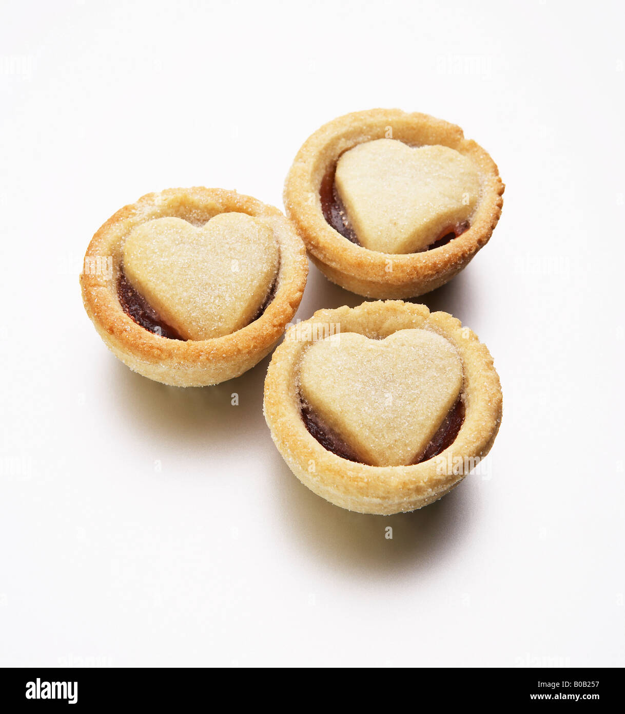jam tarts with heart shaped pastry lids Stock Photo