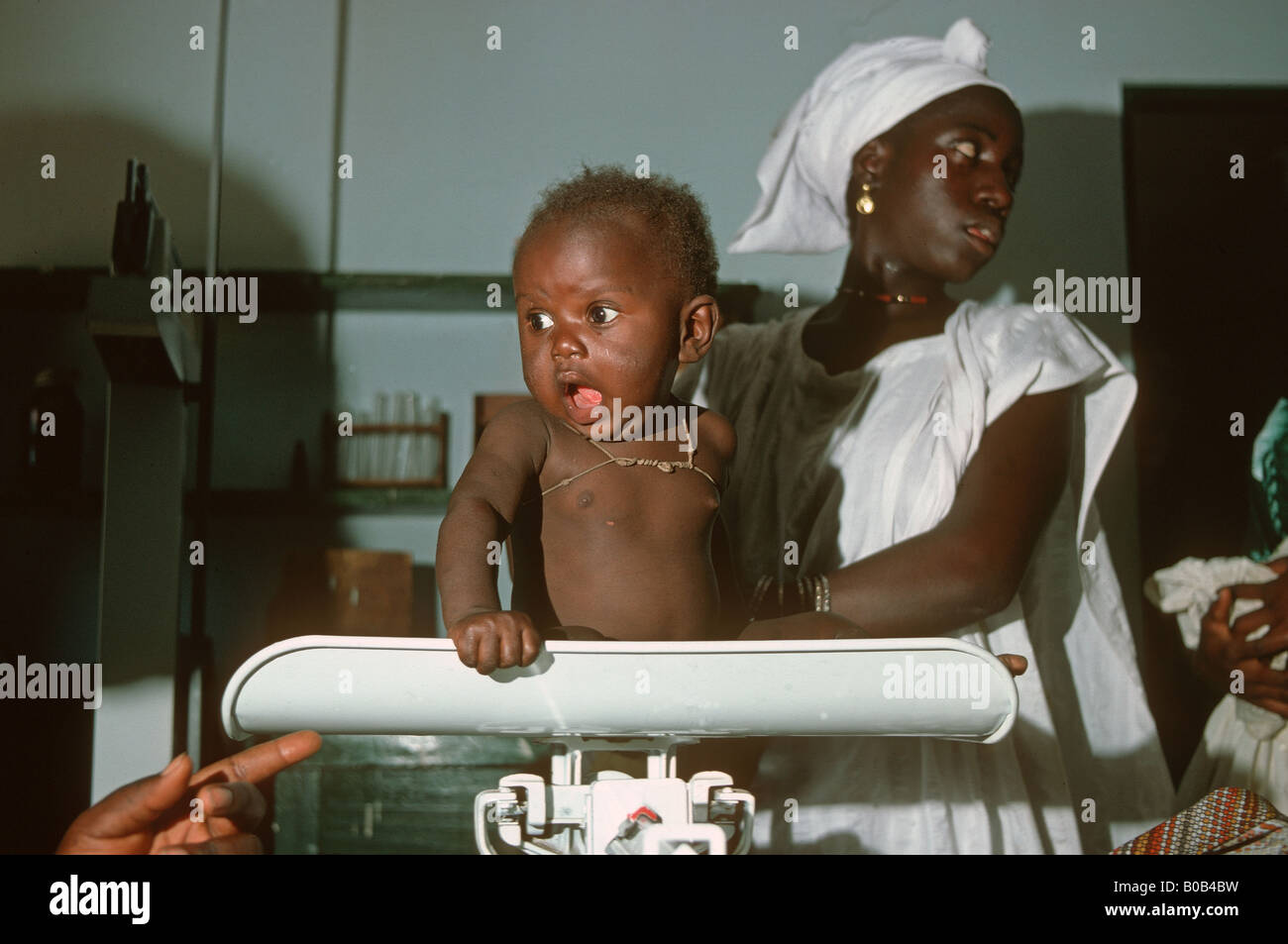 Nurse weighing child hi-res stock photography and images - Alamy