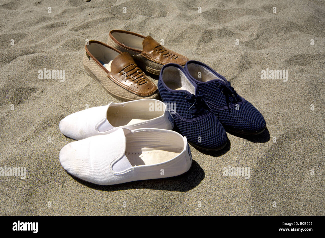 Shoes on the beach, shoe on the sand, sandy outdoors summer holiday