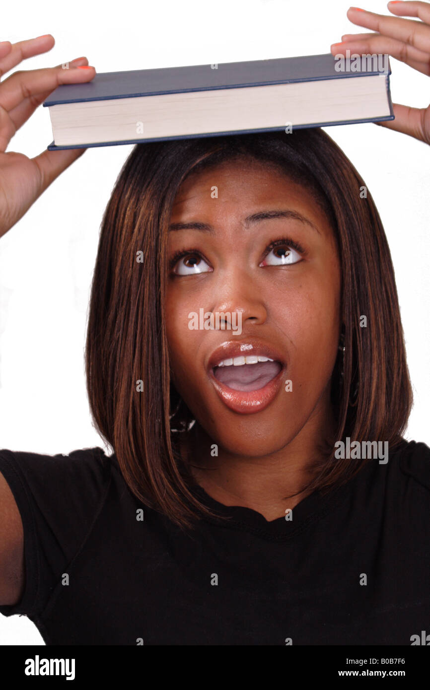 girl holding book on head Stock Photo - Alamy