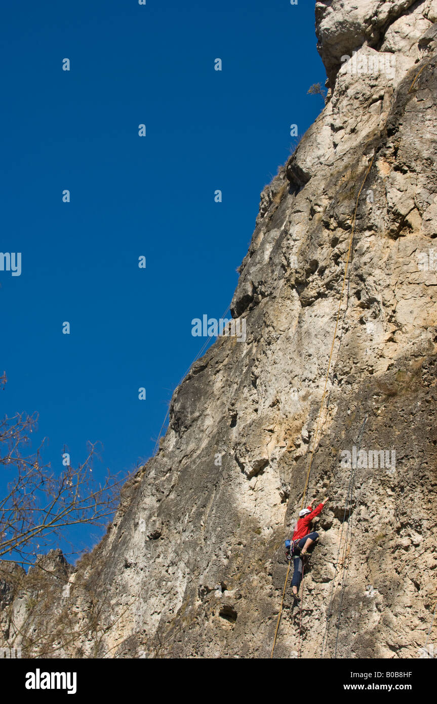 mountain climbing hill up climber healthy SPORTS outdoor fit fitness train training red blue sky