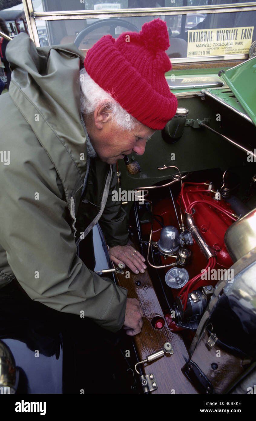 Car enthusiast examining engine, UK Stock Photo Alamy