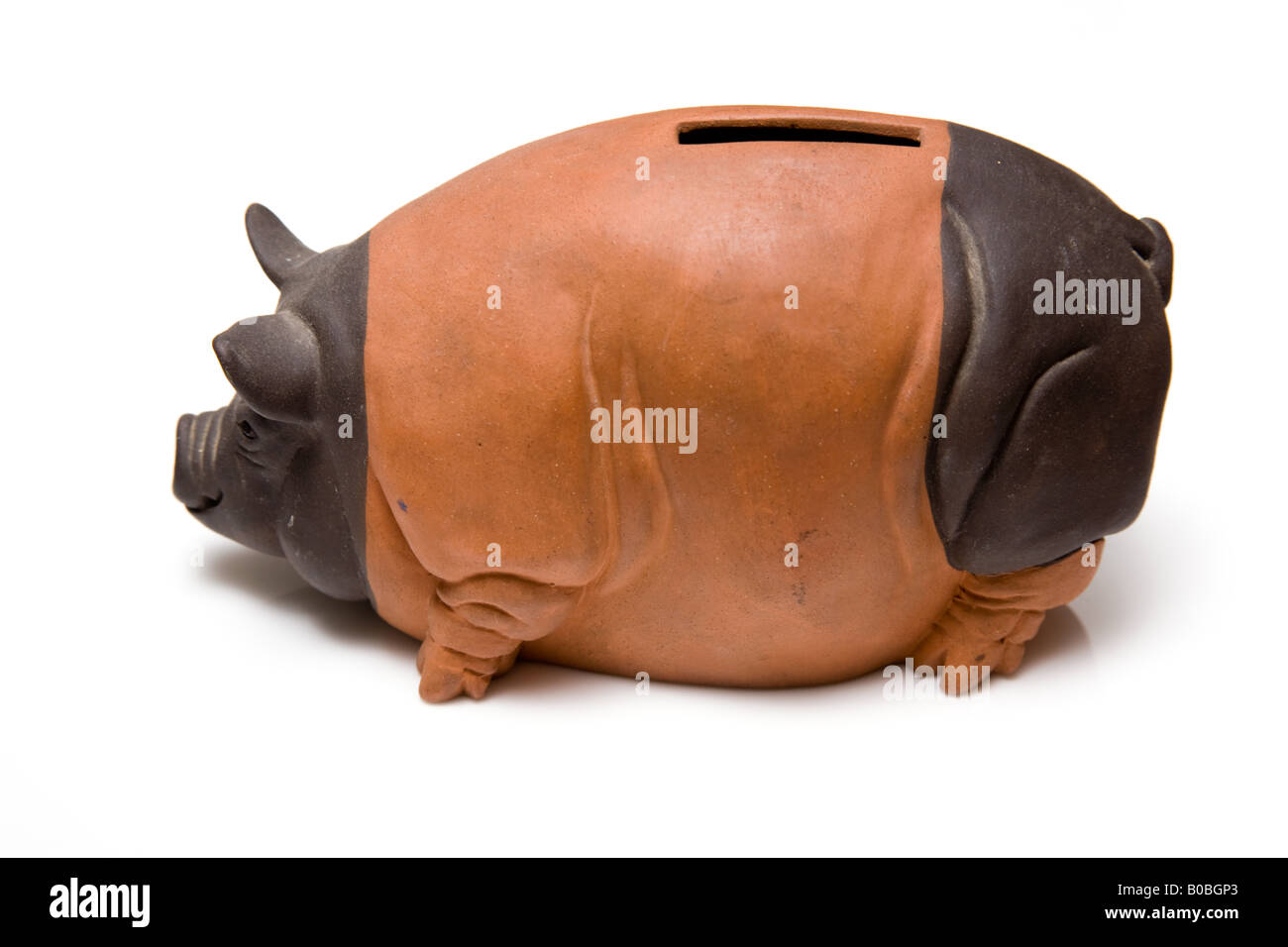 Piggy bank style money box isolated on a white studio background Stock ...