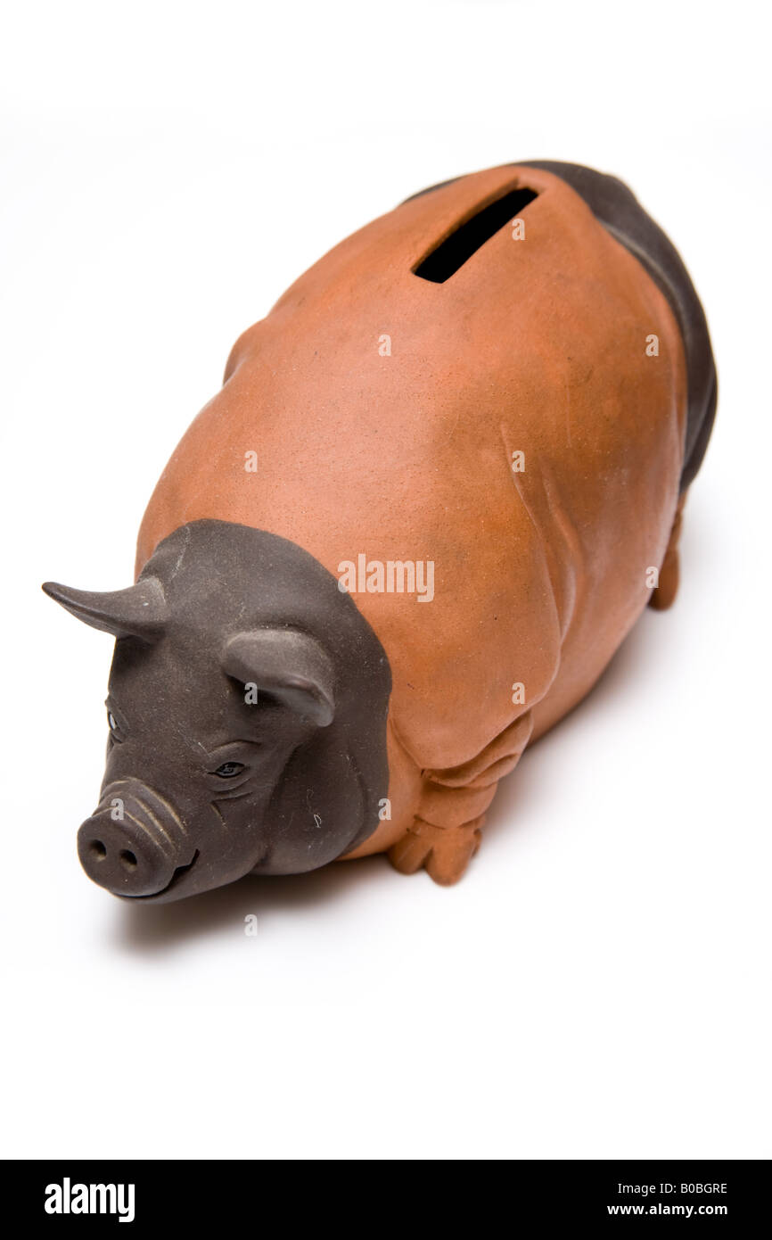 Piggy bank style money box isolated on a white studio background Stock ...