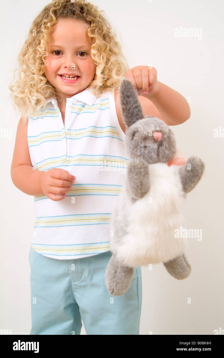 Little girl holding stuffed animal Stock Photo - Alamy