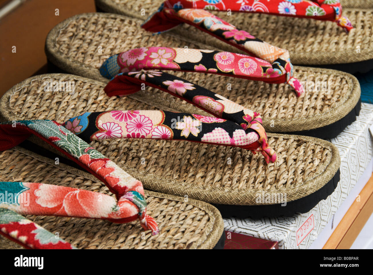 The road leading up to Asakusa s Sensoji Temple in Tokyo is lined with souvenir shops These sandals are designed as souvenirs. Stock Photo