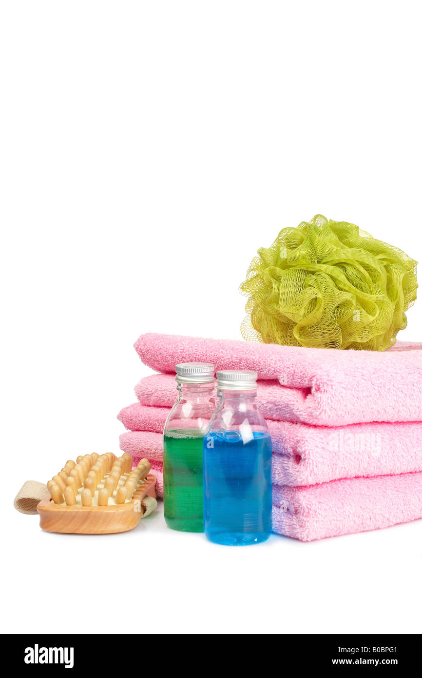 Bath accessories and beauty products reflected on white background ...
