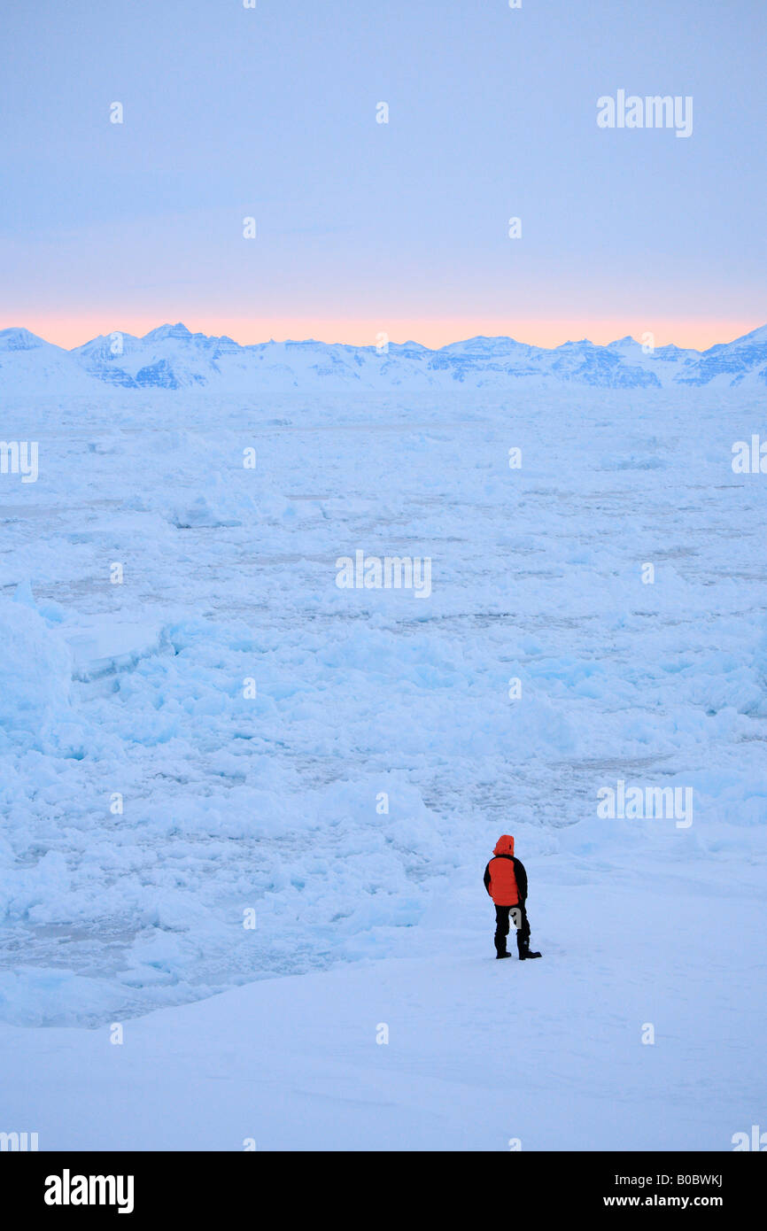 Man looking out at Pack Ice, Kap Tobin, Ittoqqortoormiit, East Greenland  Stock Photo - Alamy