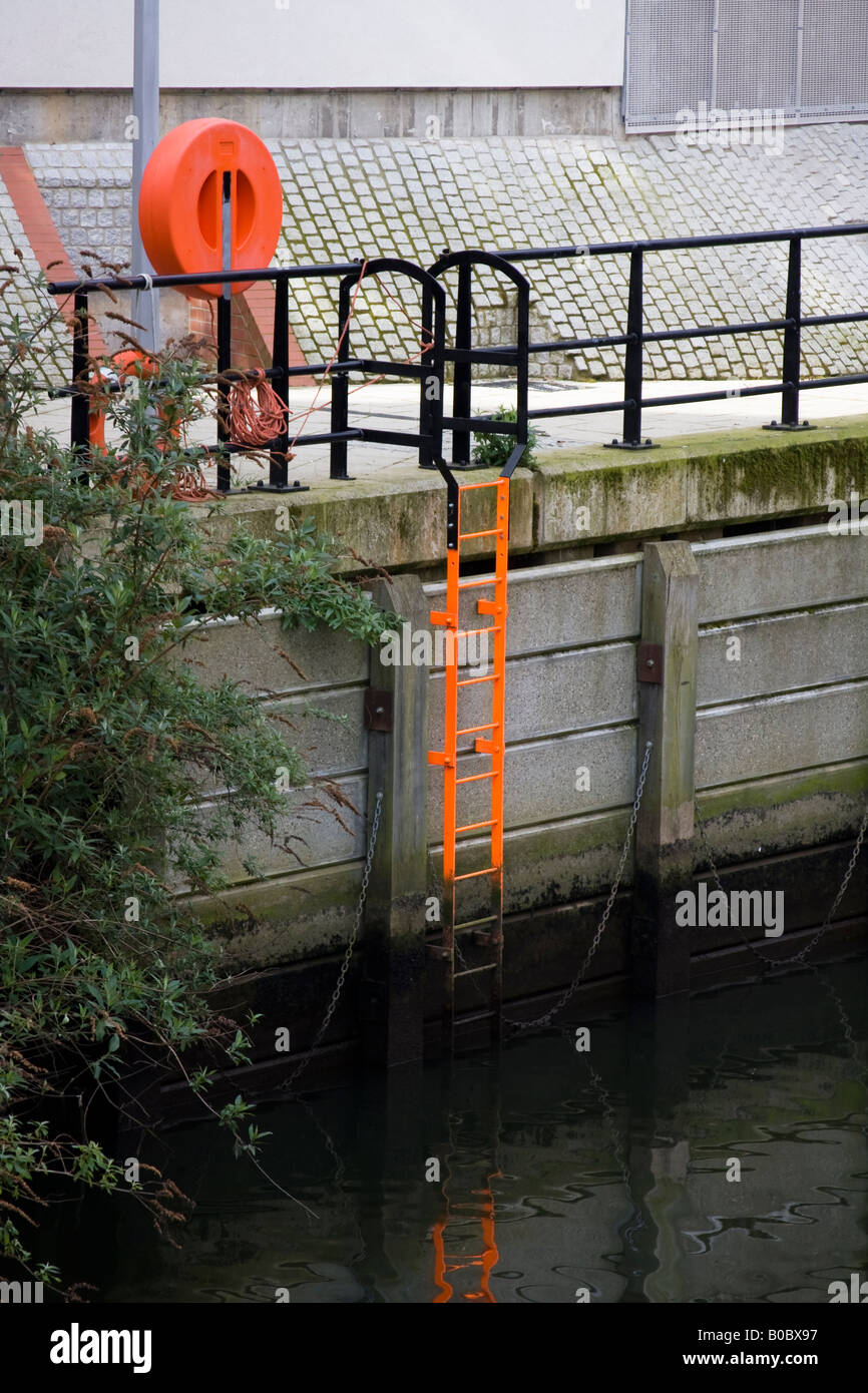 LIfe ring and safety ladder at the riverside - River Wensum Norwich Stock Photo