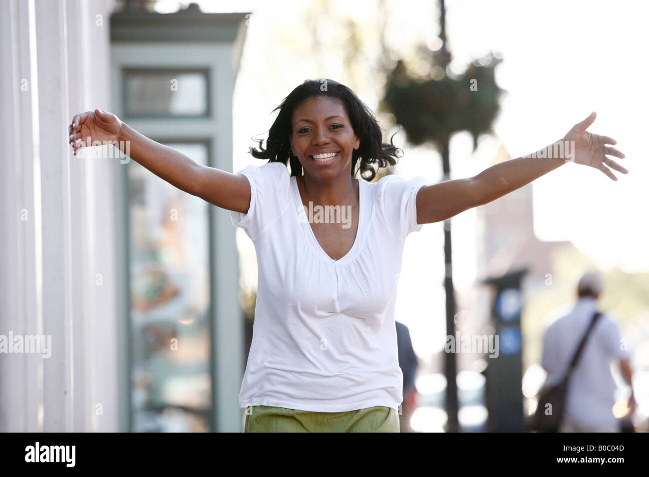 Happy black woman walking street hi-res stock photography and images ...