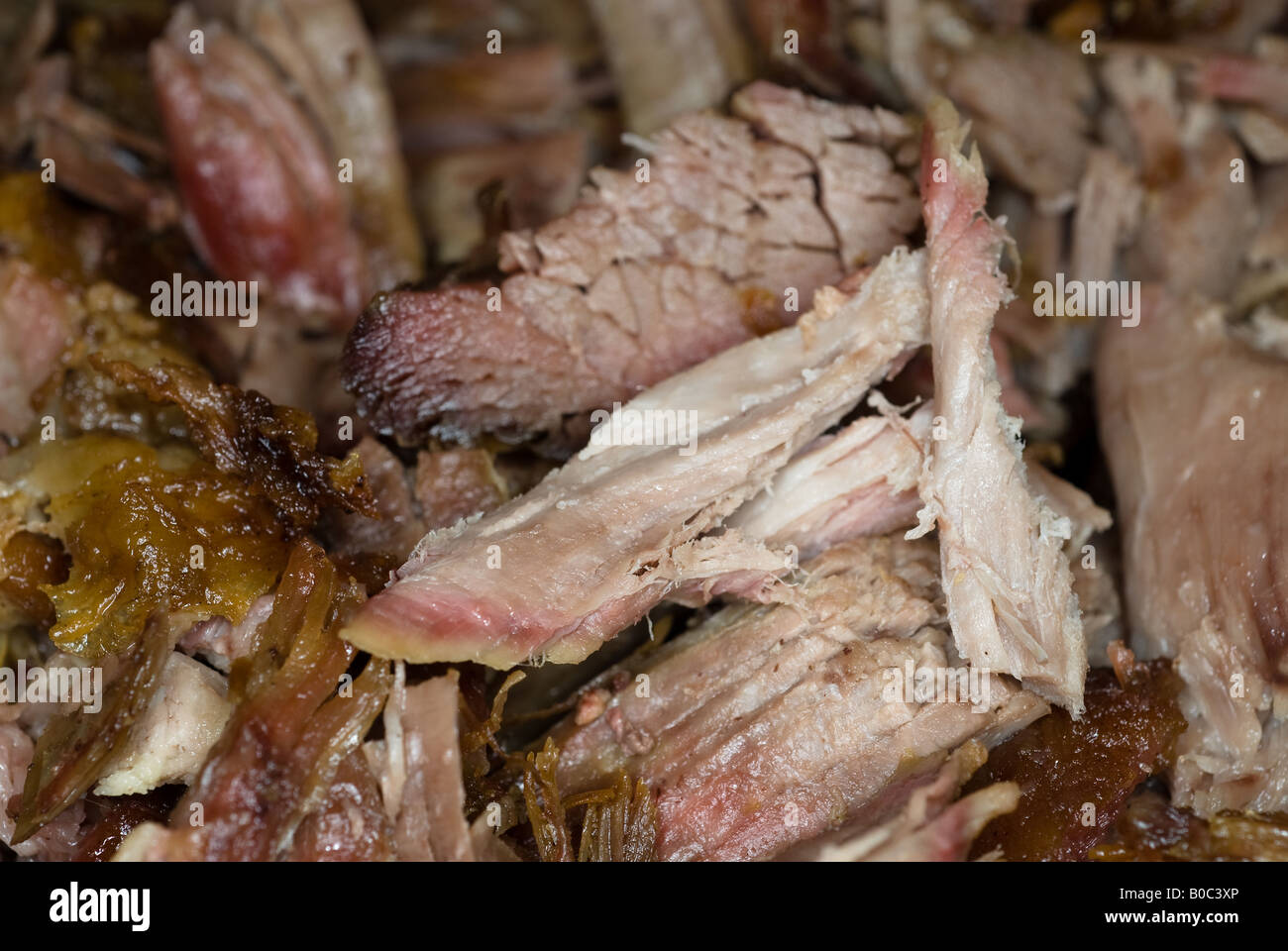 Pork chunks wait to be consumed in tacos and burritos at a fiesta Stock Photo