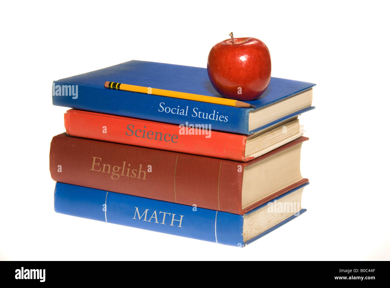 A set of old school books shown with a symbolic apple for the teacher Stock Photo