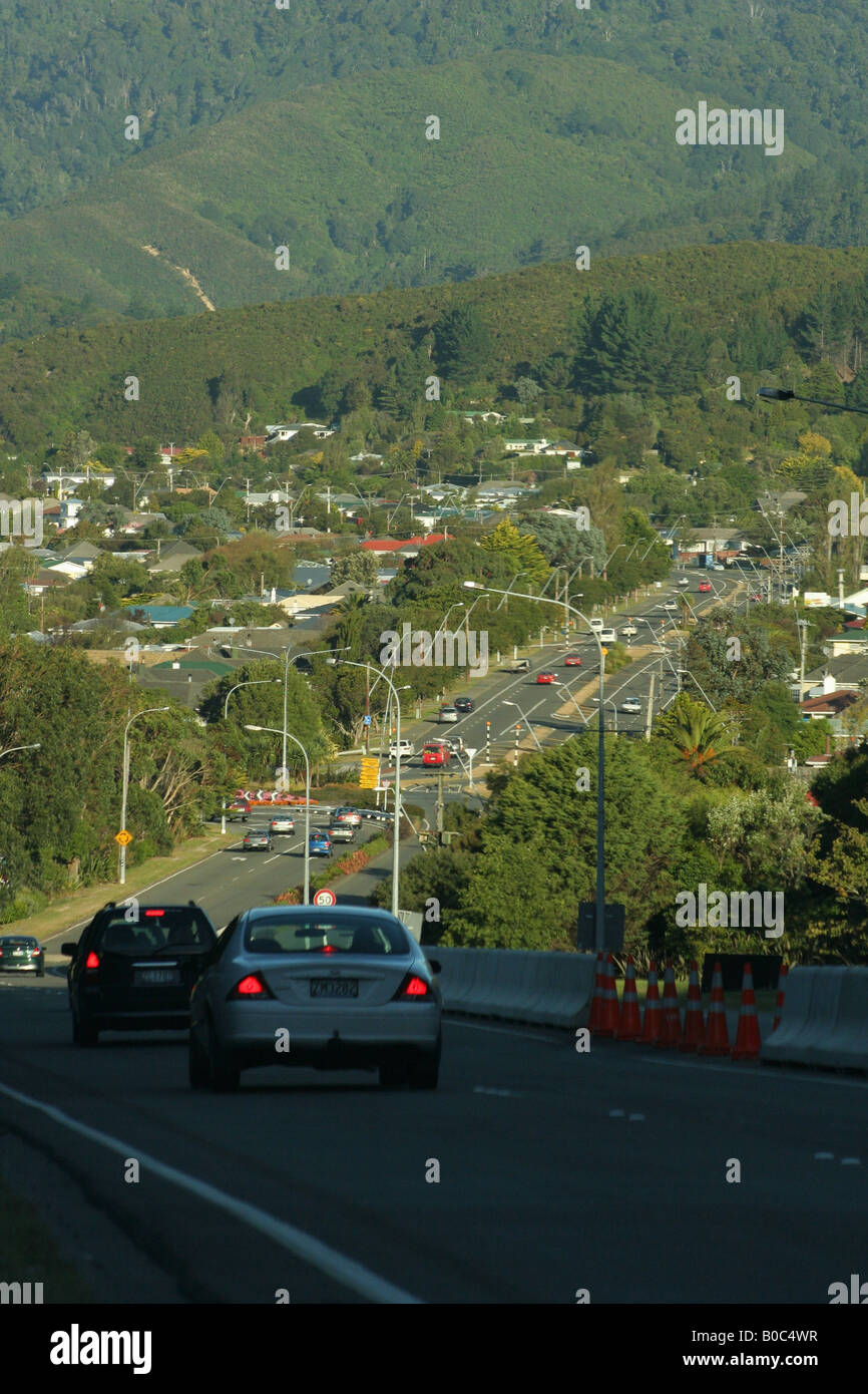 Cars travelling down a road into the Wainuiomata valley. Stock Photo