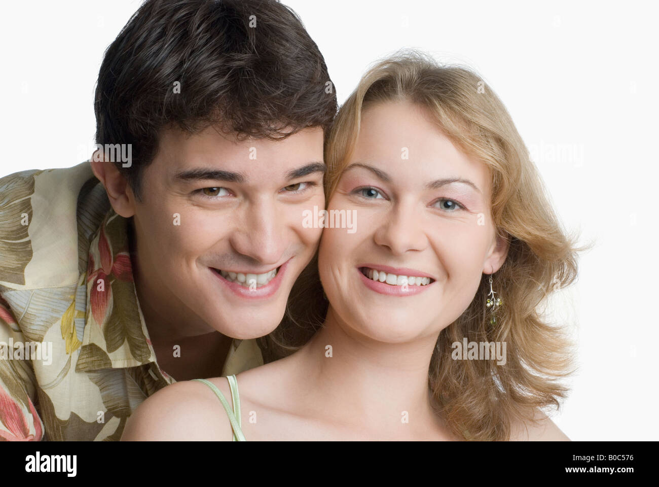 Portrait of a young couple smiling Stock Photo - Alamy