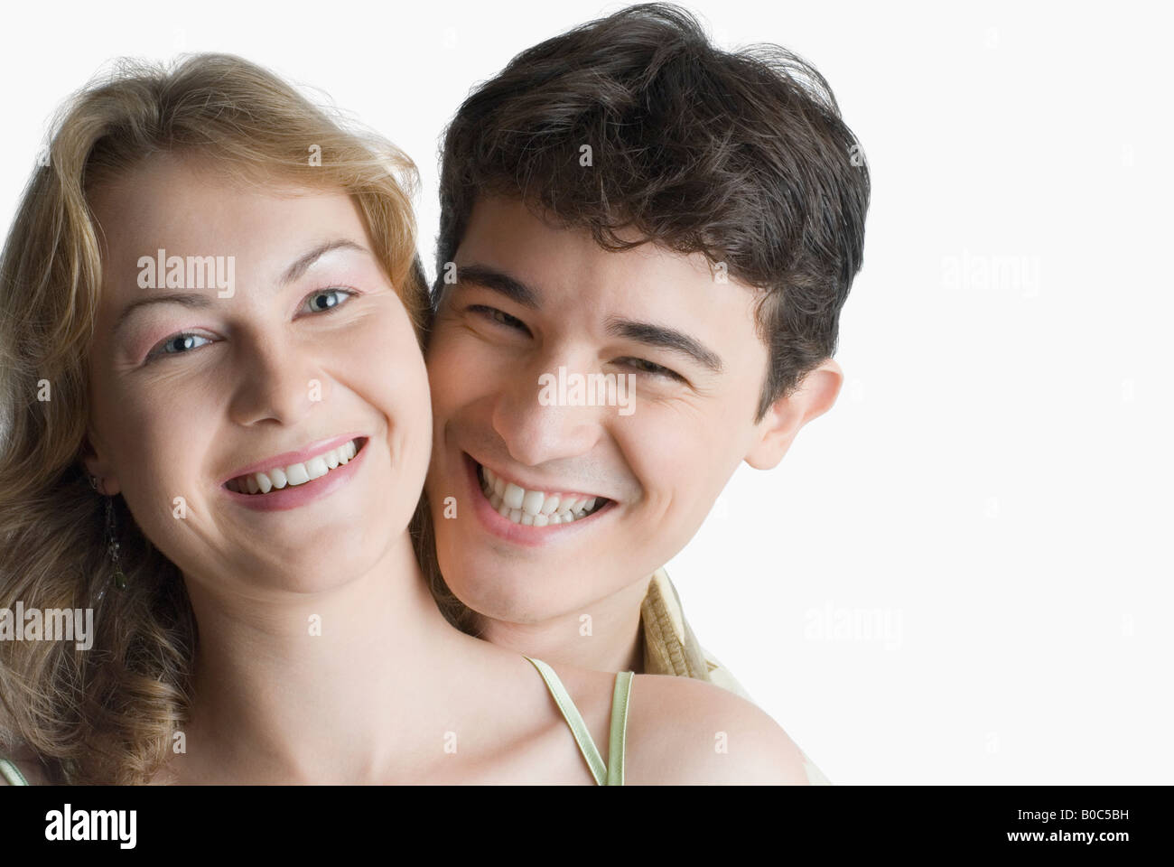 Portrait of a young couple smiling Stock Photo - Alamy